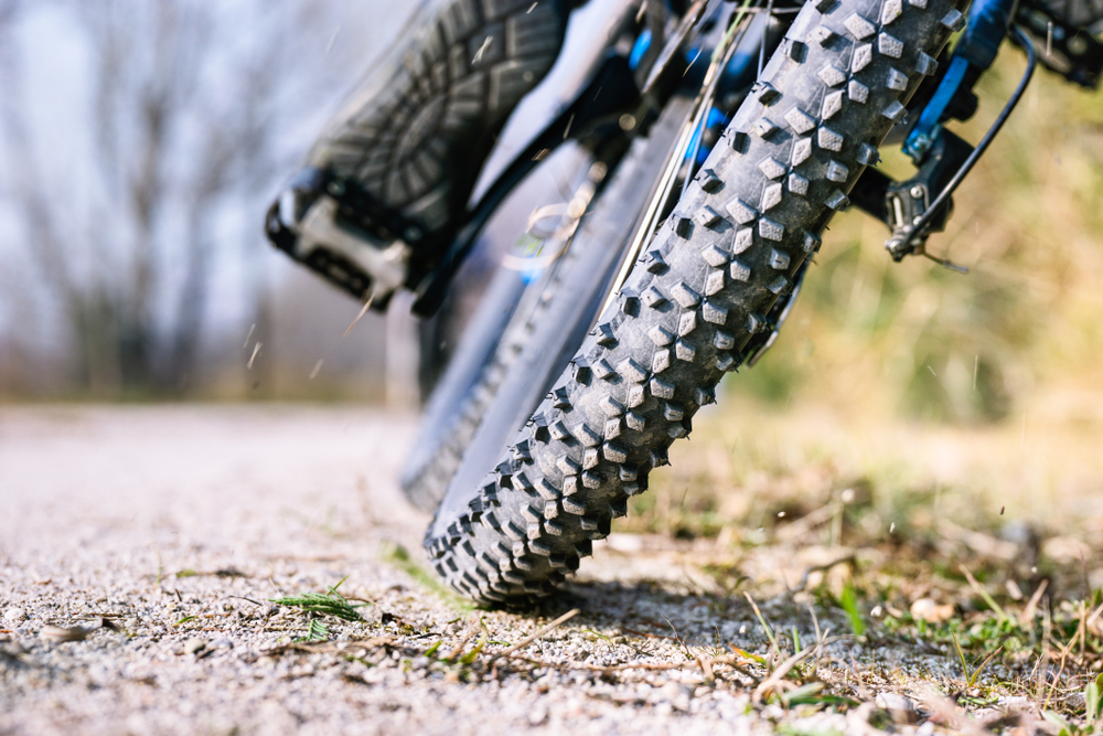 Mountain,Bike,Tire,Low,Angle,Closeup,On,Trail,-,Man