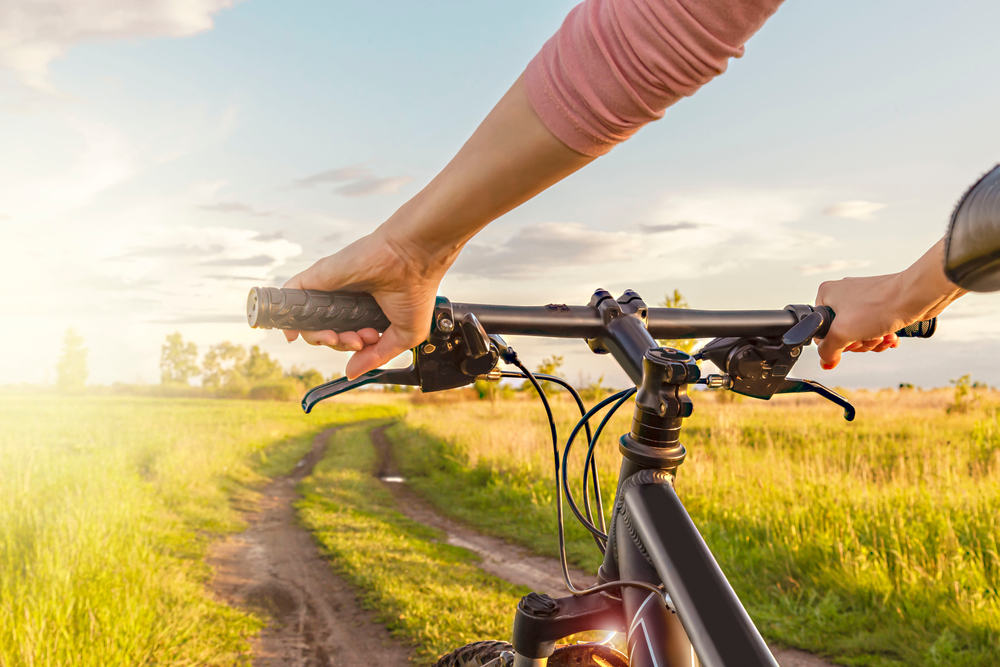 Girl,Cyclist.,Female,Hands,Clutching,A,Bike,Handle,In,Bright