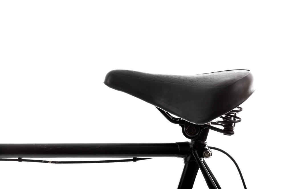 Close,Up,Shot,Of,A,Black,Bicycle,Saddle,On,White